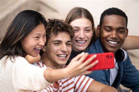 Multiracial Group Of Friends Taking A Selfie Outside Young Beautiful