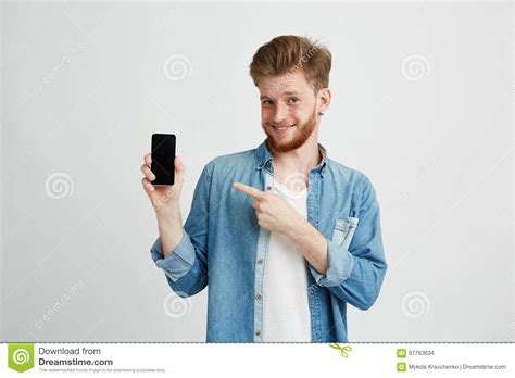 Cheerful Young Handsome Man Smiling Looking At Camera Pointing Finger