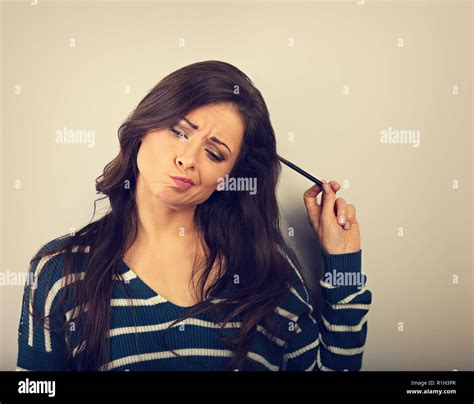 Confusion Grimacing Brunette Woman Thinking And Looking Up With