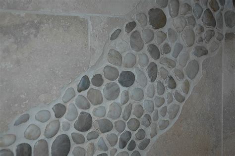 Shower wall river rock | Shower wall, Wall tiles design, Basement ...