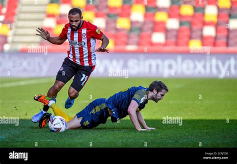 London UK 27th Feb 2021 Nick Powell Of Stoke City And Bryan Mbeumo