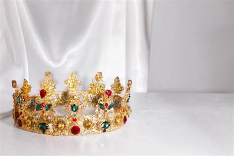 Beautiful Golden Crown With Gems On Light Grey Table Space For Text