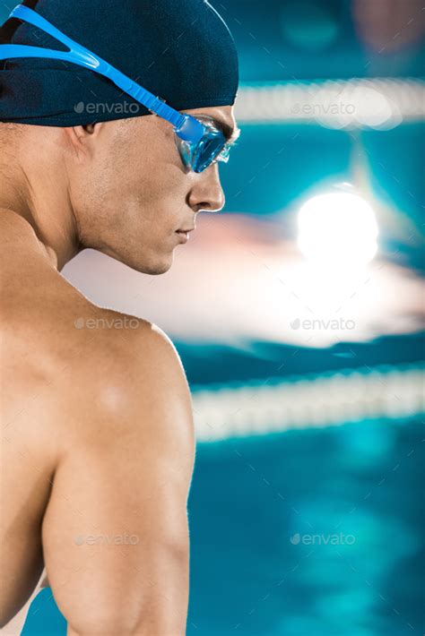 Handsome Muscular Swimmer In Swimming Cap And Goggles Stock Photo By