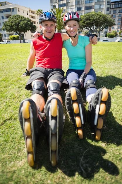 Premium Photo Fit Mature Couple Wearing Roller Blades On The Grass