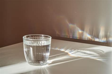 Premium Photo | A glass of clean drinking water in the morning sun