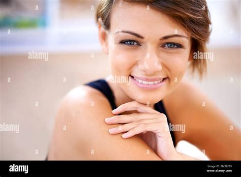 Keep Fit Stay Happy A Fit Young Woman Sitting On A Gym Floor Stock