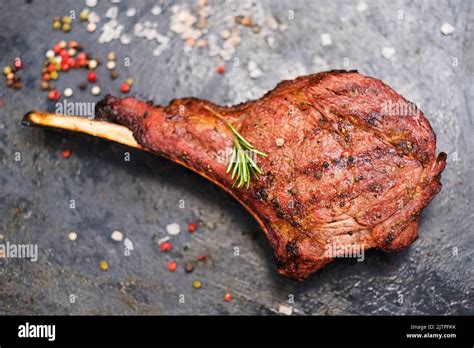 steakhouse menu cowboy steak seasoning rosemary Stock Photo - Alamy