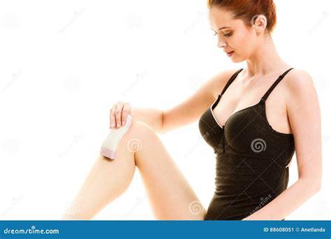 Woman Shaving Her Legs With Electric Razor Stock Image Image Of Legs