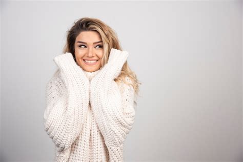 Free Photo Blonde Woman In Knitted Sweater Smiling Happily