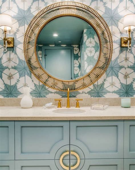 The Instagram Page Shows An Image Of A Bathroom With Blue Cabinets And