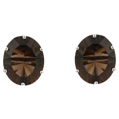 6 64 Carat Incised Smoky Quartz Prong Set Studs In 14 Karat Yellow Gold