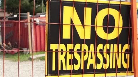 no trespassing signs on orange locked ga... | Stock Video | Pond5