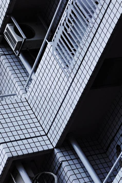 An Overhead View Of A Tall Building With Tiled Walls And Flooring On