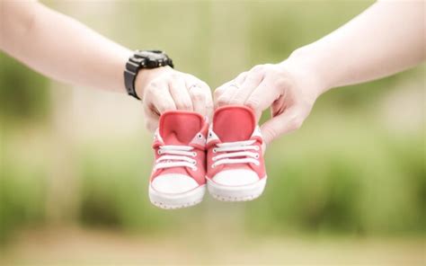 Premium Photo Cropped Image Of People Holding Baby Booties