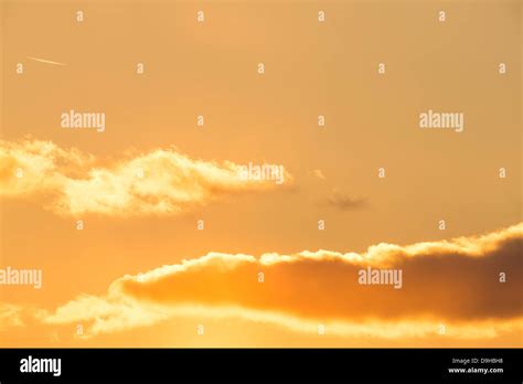 Golden clouds at sunset Stock Photo - Alamy