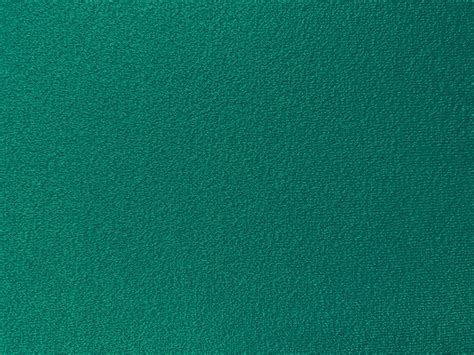 Dark green cotton fabric texture used as background. Empty green fabric ...