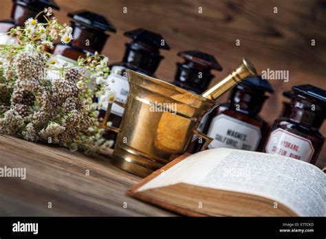 The Ancient Natural Medicine Herbs Medicines And Old Book Stock Photo