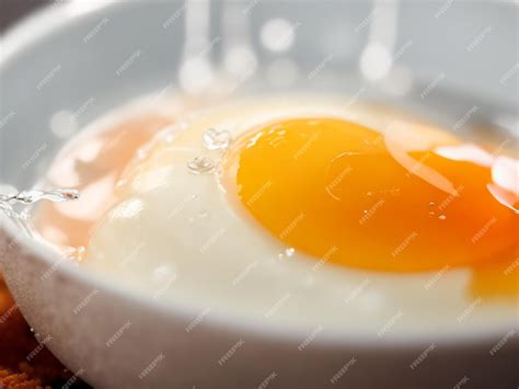 Premium Photo Focus Shot Of Fried Egg And Water Drop On Cozy Blurred Background