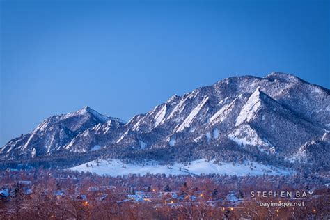 Photo: Flatirons and the city of Boulder in winter just before sunrise. Boulder, Colorado.