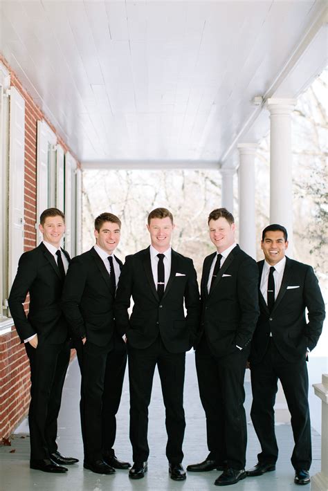 Groom and Groomsmen in Black Tuxedos