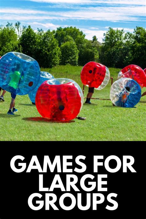 several people are playing with large inflatable balls on the grass and ...