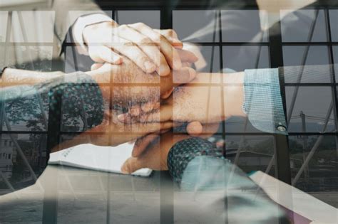 Premium Photo Cropped Image Of Business People Stacking Hands In Office