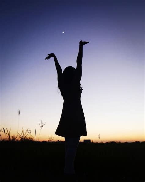 Premium Photo Silhouette Woman Standing On Field Against Clear Sky