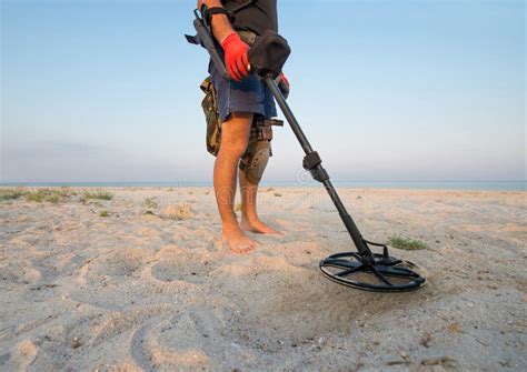 Man With A Metal Detector On A Sea Sandy Beach Stock Photo Image Of