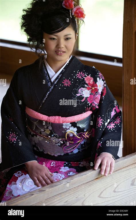 Beautiful 19 Year Old Japanese Girl Wearing Traditional Furisode Long Sleeve Kimono With Spring