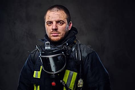 Studio Portrait of a Male Dressed in a Firefighter Uniform. Stock Image ...