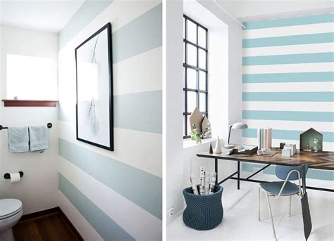 Two Photos Of A Bathroom With Blue And White Stripes On The Walls