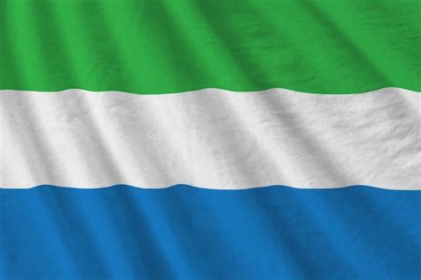 Premium Photo Sierra Leone Flag With Big Folds Waving Close Up Under