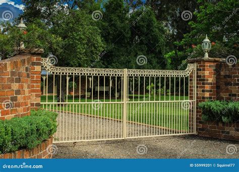 Metal Entrance Gates Set in Brick Fence Stock Image - Image of iron ...