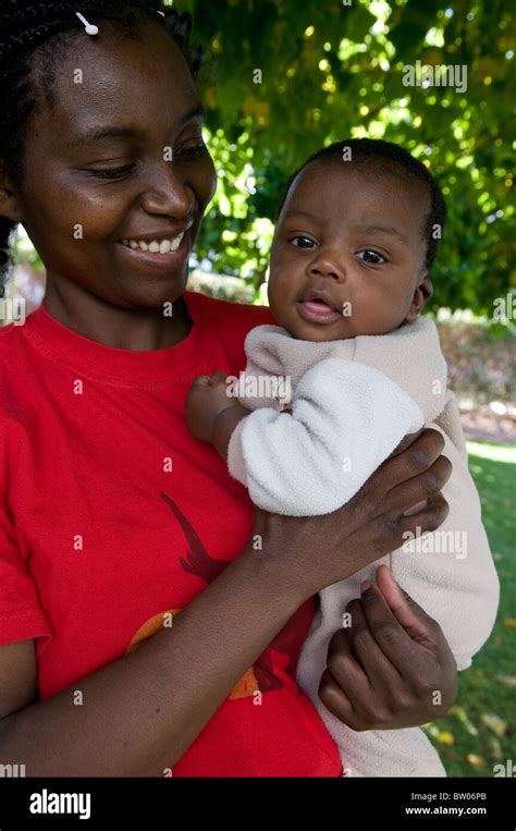 South African Woman Holding A Baby Cape Town South Africa Stock Photo