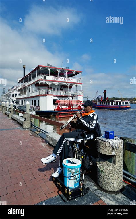 Street Musician Playing for Tips on River Street in Savannah, georgia Stock Photo - Alamy