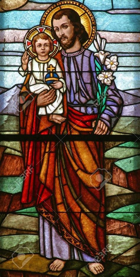 Stained Glass With St Joseph Holding Baby Jesus Stock Photo