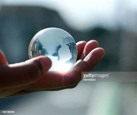 Hand Holding Glass Orb Photos And Premium High Res Pictures Getty Images