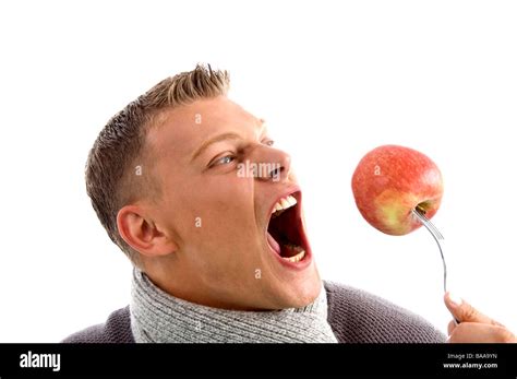 Portrait Of Man Holding Apple With Fork Stock Photo Alamy