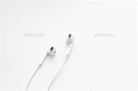 white headphones on white background Stock Photo by epovdima | PhotoDune