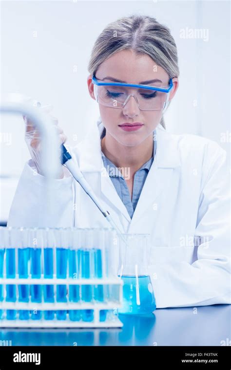 Science Student Using Pipette In The Lab Stock Photo Alamy