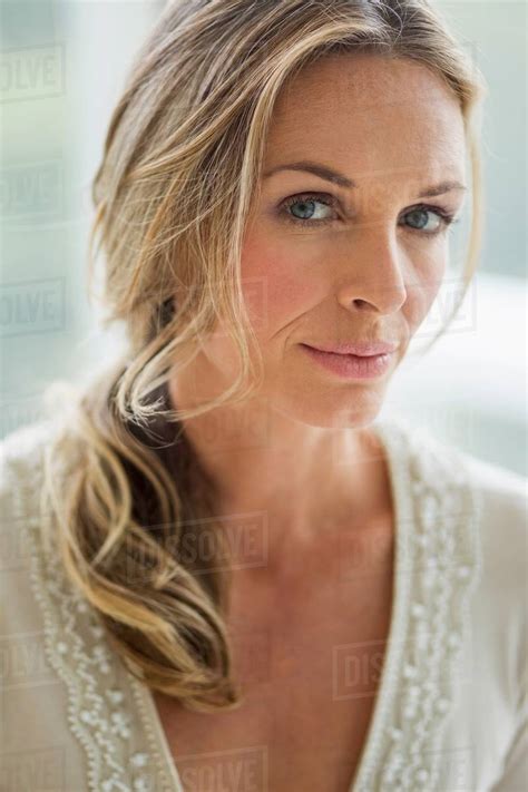 Mature Blonde Woman Looking At Camera Portrait Stock Photo Dissolve