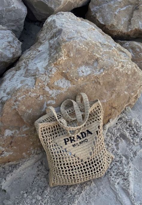 A Bag Sitting On Top Of Some Rocks Next To A Pile Of Large Rocks With