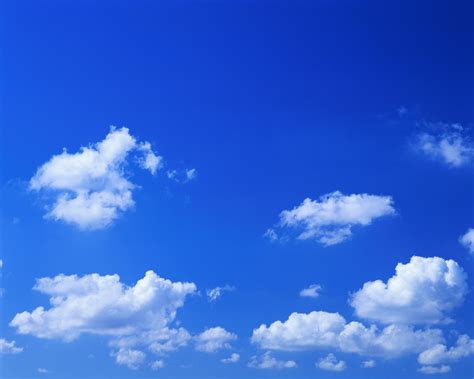 scattered cumulus clouds   blue sky