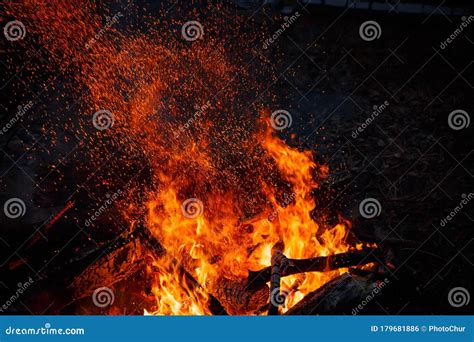 Campfire Flame With Sparks Flying Up Stock Photo Image Of Bonfire