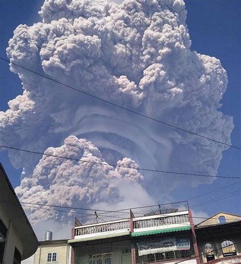 View of the rising eruption column of the Sinabung volcano (Sumatra ...