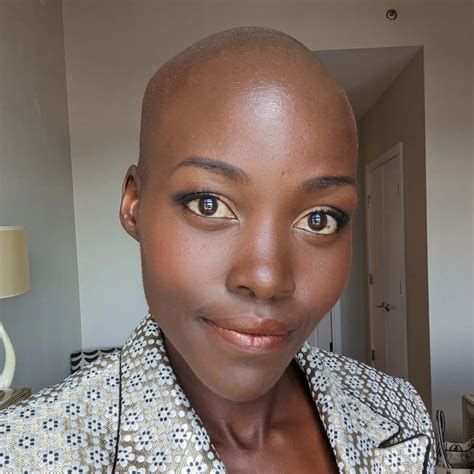 Lupita Nyong'o debuts bald shaved head: 'Happy without hair'