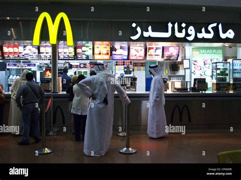 Men In Traditional Arab Dress At Mcdonalds Dubai International Airport