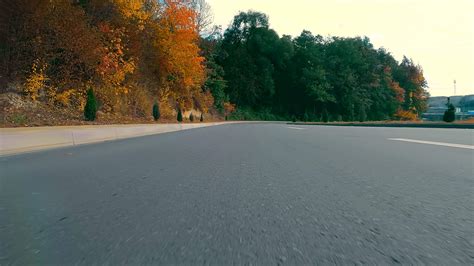 view from the bumper of the car on the highway. The camera looks at the