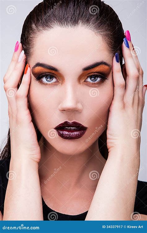 Natural Health Beauty Of A Woman Face Close Up Orange Eyes Make Up