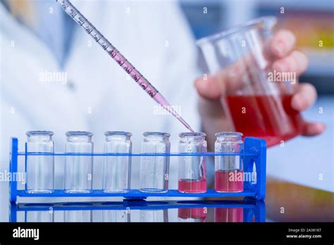 Using pipette in the laboratory Stock Photo - Alamy